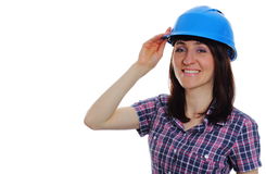 mujer sonriente del constructor que lleva el casco azul protector 54892525